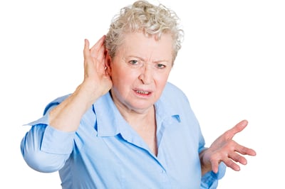 Closeup portrait, unhappy hard of hearing senior mature woman placing hand on ear asking someone to speak up, or bad news, isolated white background. Negative emotion, facial expressions, feelings.