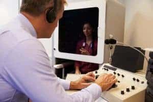 Audiologist performing a hearing test