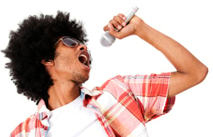 Black man singing with a microphone - isolated over a white background