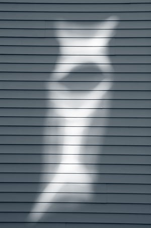 Ghostly reflection on outdoor siding of church