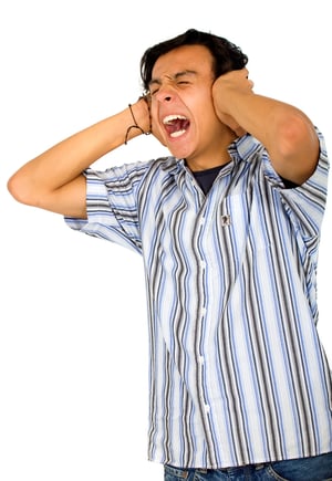 casual annoyed man screaming and covering his ears because he cant stand the noise - isolated over a white background-1